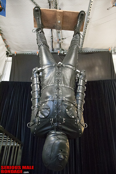 Suspended in a Leather Bondage Gimp Suit.