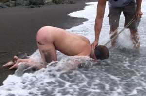 Amateur video of Micah Andrews being used and abused on a public beach.